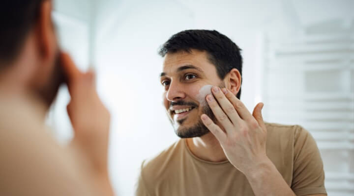 man using skincare